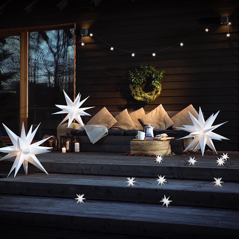 LED Lichterkette Leuchtsternenkette/ Baby-Sternenlichterkette 18 Zacken, weiß, 9 Sterne Ø 8cm - für innen und außen, mit Trafo